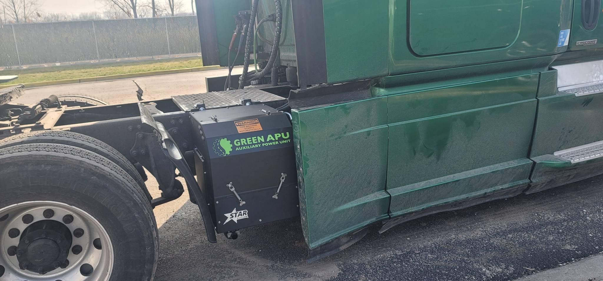Green semitruck with Green APU auxiliary power unit installed