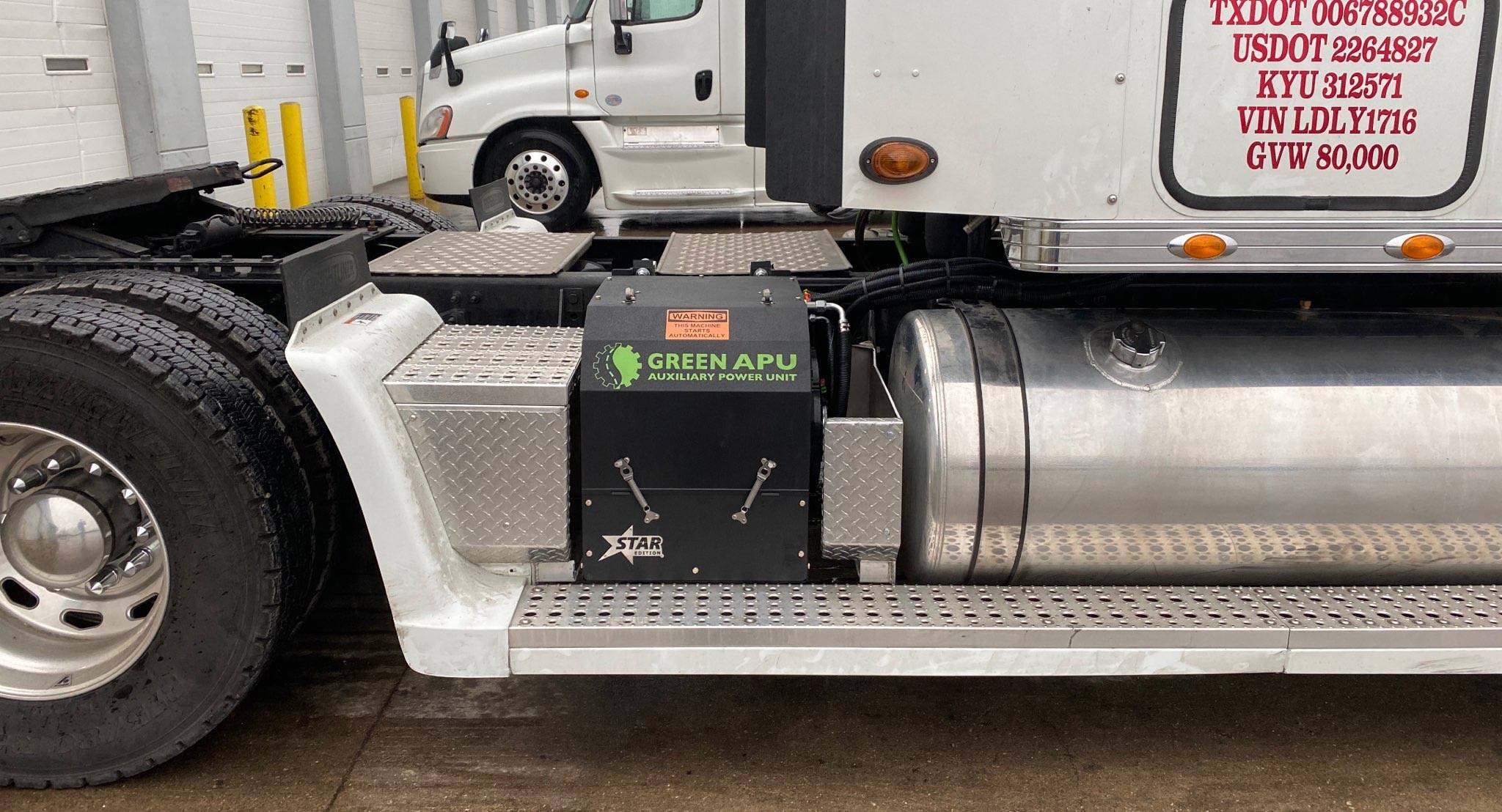 White semi truck with Green APU auxiliary power unit installed